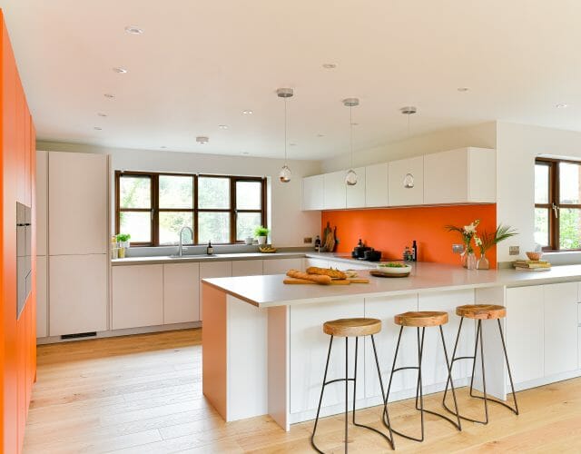 White Kitchen with Orange Accents