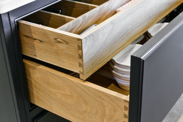 Dovetail solid oak drawer boxes with internal cutlery divider in a bespoke kitchen cabinet, Ashley Jay Kitchens